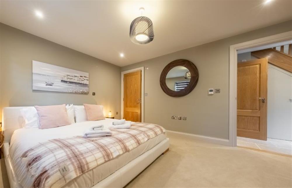 Master bedroom with 6’ super-king bed at George House, Docking near Kings Lynn