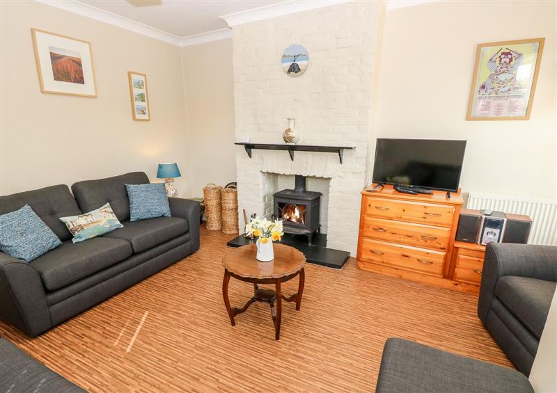 Relax in the living area at Ghillie Cottage, Freshwater