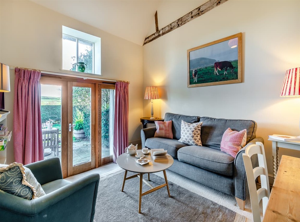 Living room/dining room at Giddy Cottage in East Dean, East Sussex
