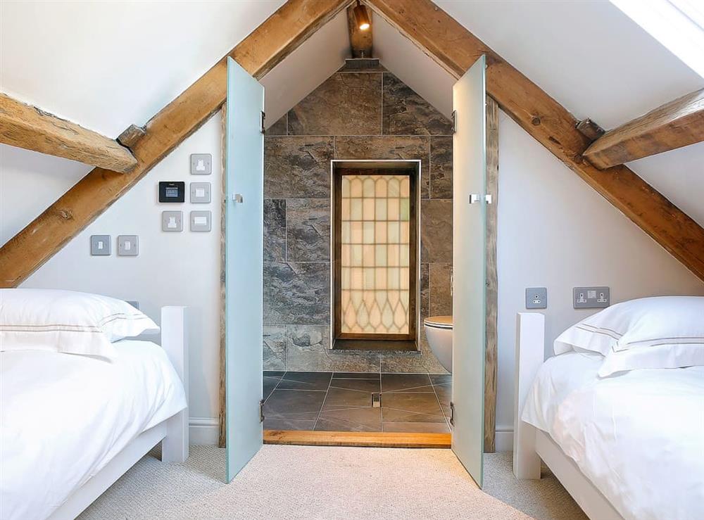 Light and airy twin bedroom at The Coach House, 