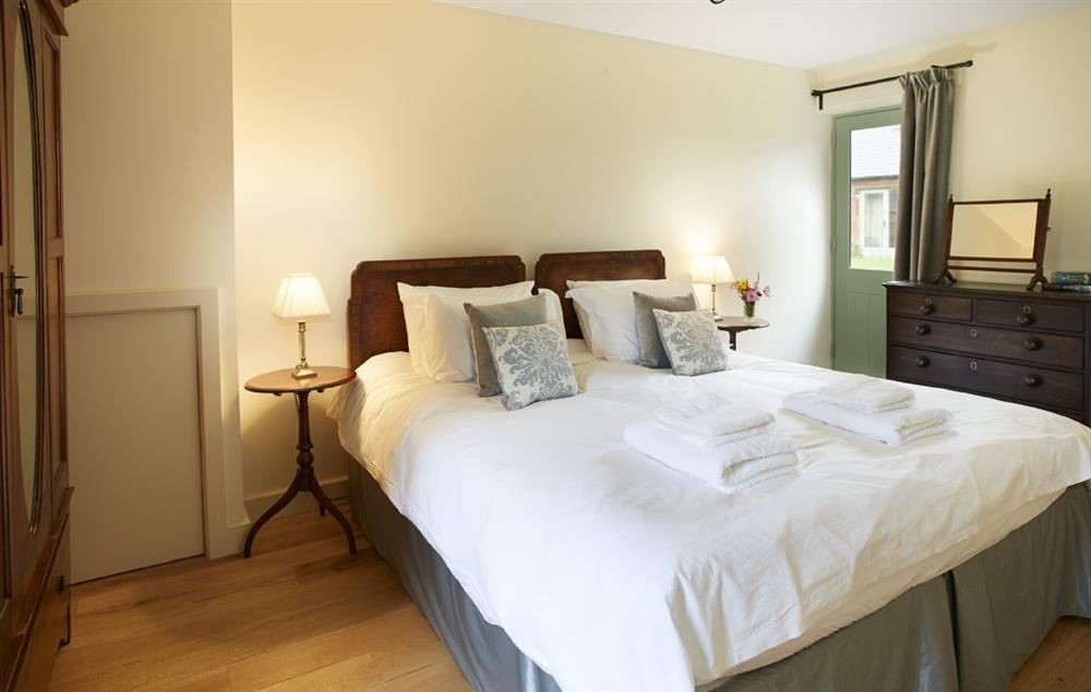 Double bedroom with 5’ bed and en suite shower room at Gill Beck Barn, Melmerby