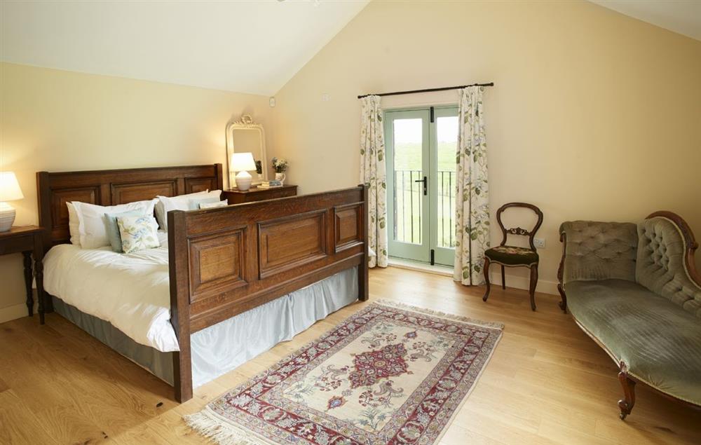 Master bedroom suite with 6’ bed and en-suite at Gill Beck Barn, Melmerby