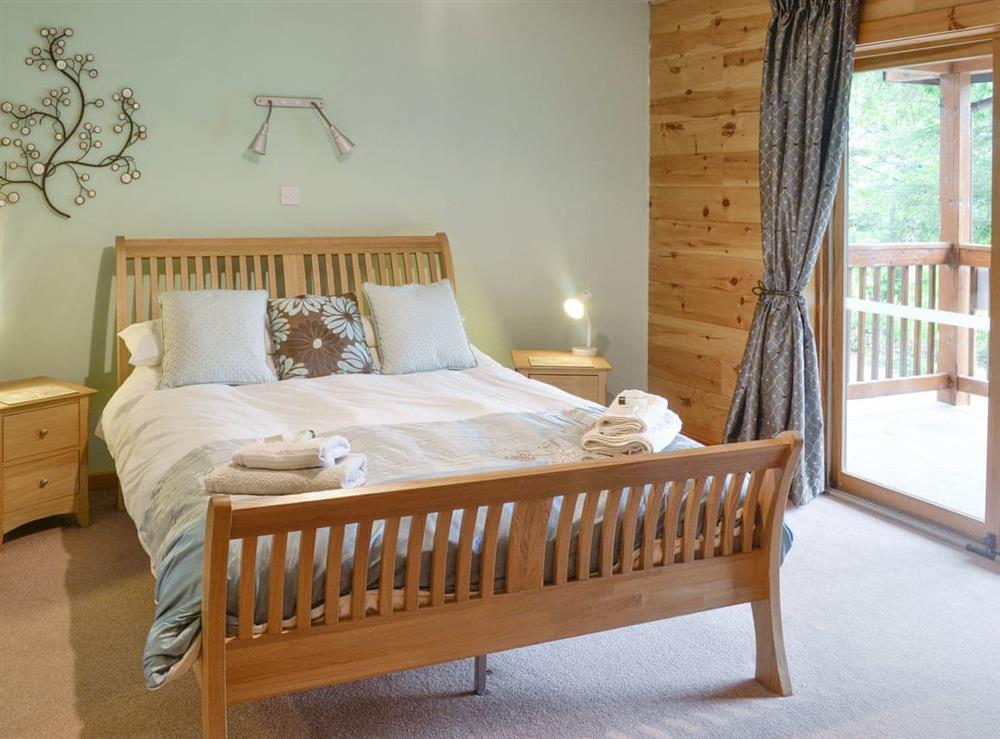 En-suite master bedroom with door to terrace at Gilnockie in Kippford, near Dalbeattie, Kirkcudbrightshire