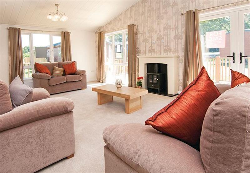 The living room in Premier Country Lodge Six Platinum at Gimblet Rock in Gimblet Rock, Pwllheli