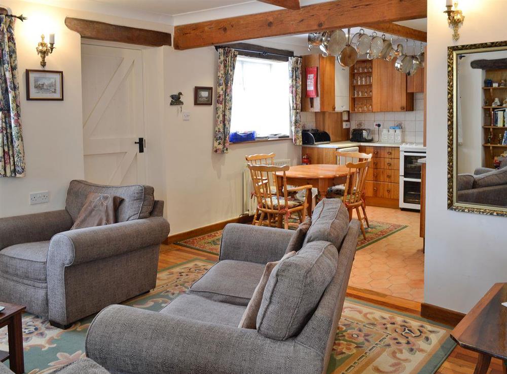 Lounge leading to kitchen dining area at Gingerbread Cottage in Fairford, Gloucestershire