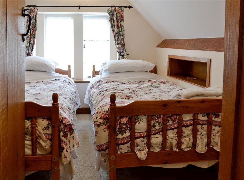 Twin bedroom at Gingerbread Cottage in Fairford, Gloucestershire