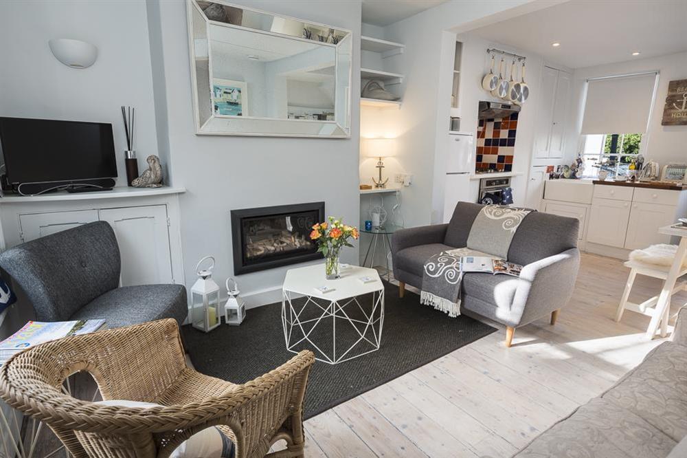 Sitting area with comfy sofas and chairs at Ginn Cottage in , Salcombe