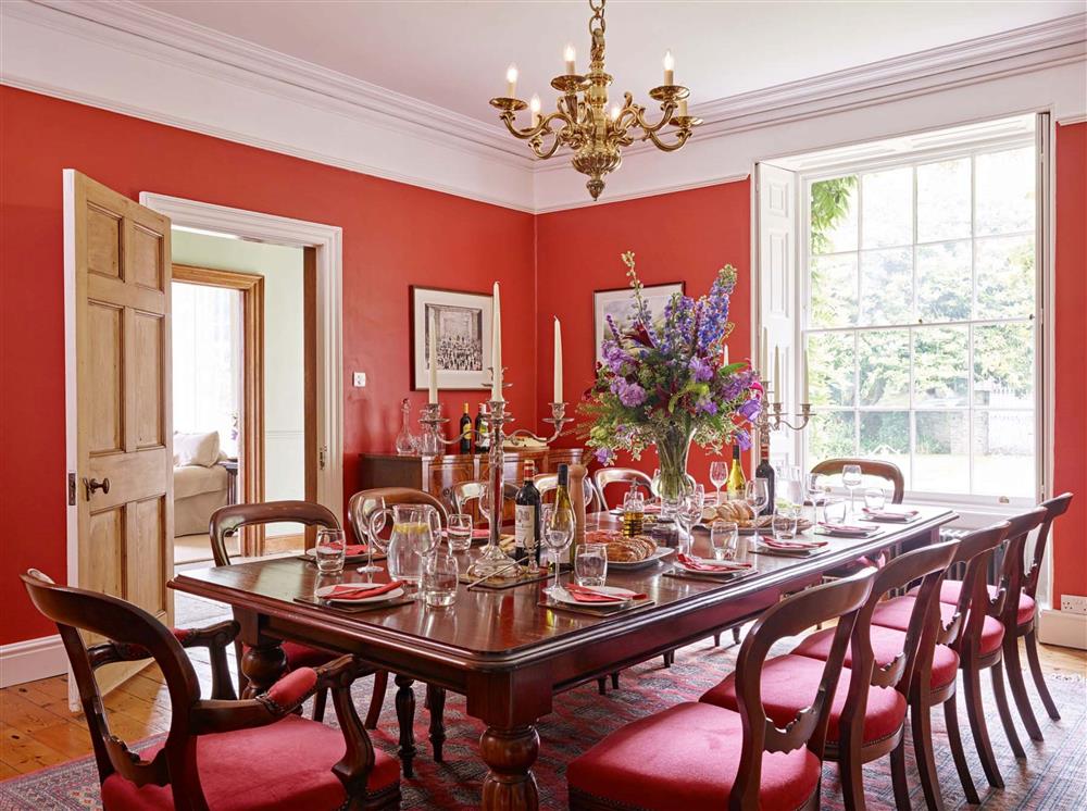 The beautiful formal dining room, with mahogany table and chairs  at Gitcombe House, Dartmouth