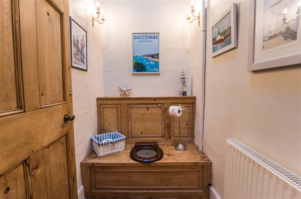 The cloakroom located on the first floor, with original ’thunder box’ WC at Gitcombe House, Dartmouth