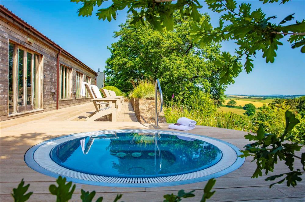 The shared hot tub with views of the Dartmoor National Park at Gitcombe House, Dartmouth