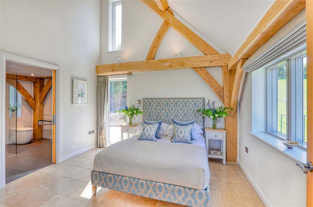 Bedroom one, located on the ground floor with an accessible en-suite at Gitcombe Retreat, Dartmouth