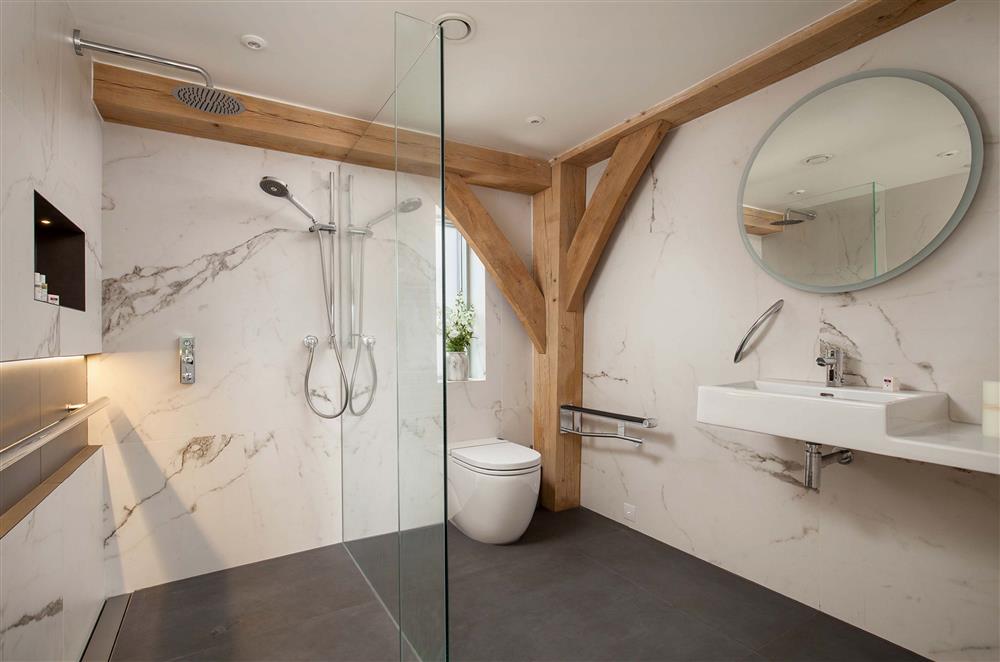 The accessible en-suite shower room located on the ground floor at Gitcombe Retreat, Dartmouth