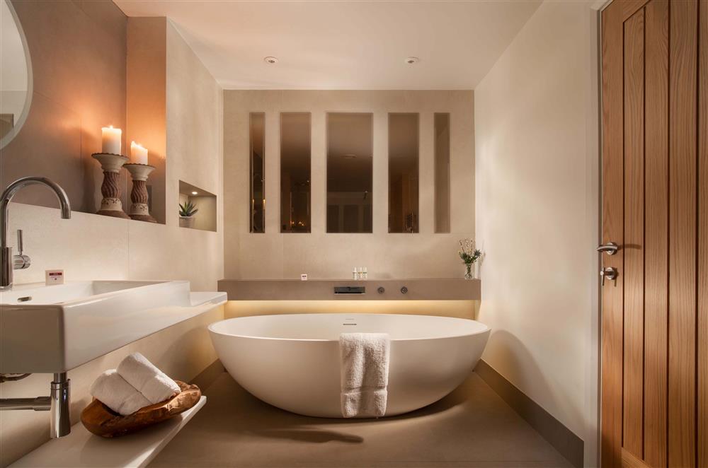 The impressive Ashton and Bentley designer bath in the lower ground floor bathroom at Gitcombe Retreat, Dartmouth