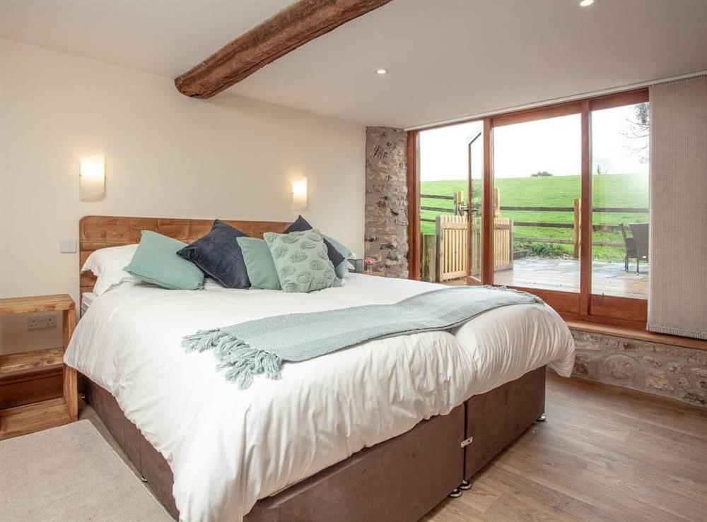 Double bedroom at Gittishayne Farm Barn in Colyton, Devon