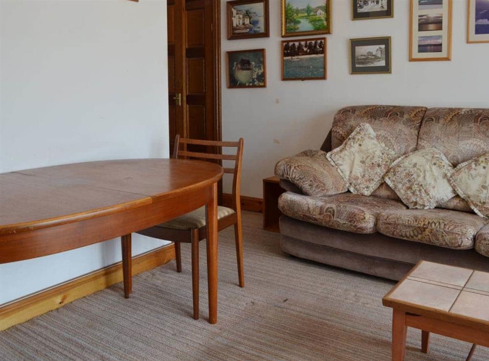 Living/dining room with classic dining table at Glan-Mor in Pwllheli, Gwynedd