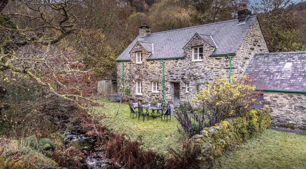 The exterior of Glan yr Afon with its open garden and stream, Gwynedd at Glan Yr Afon in Dolwyddelan, Gwynedd