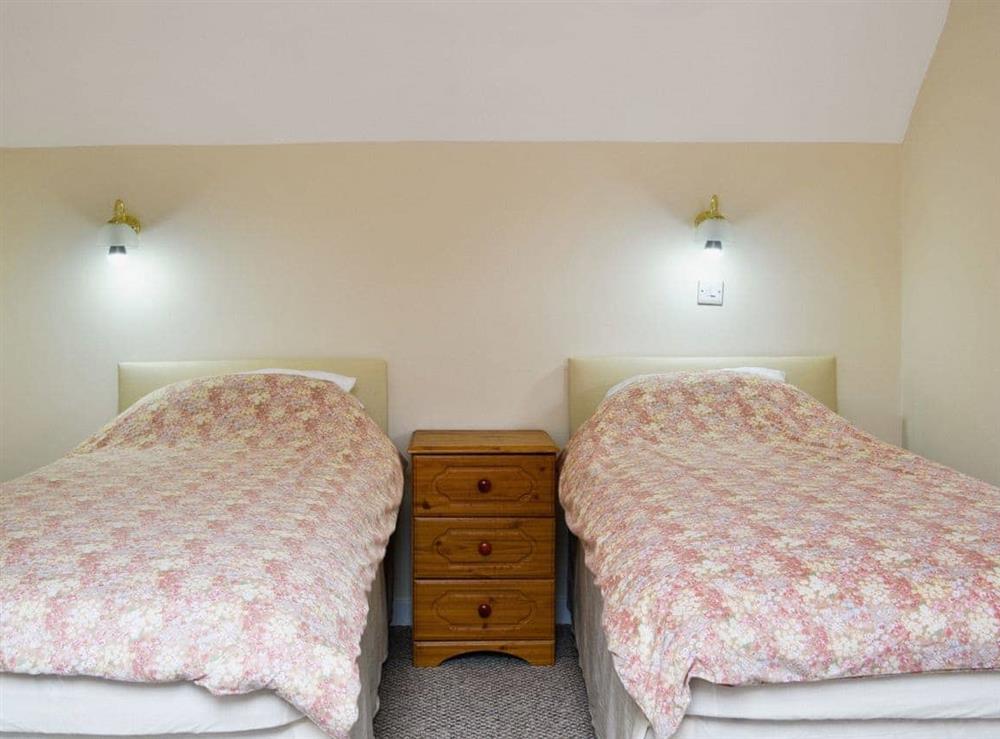 Twin bedroom at Glanmwrg Barn in Llangennech, near Llanelli, Dyfed