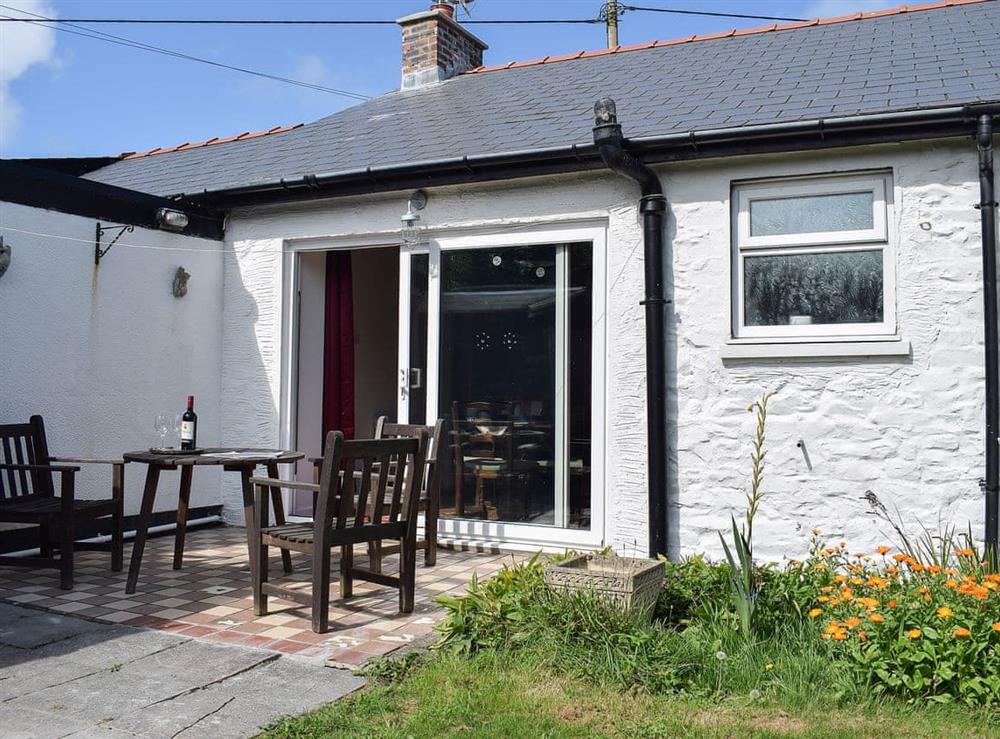 Charming paved area outside the living/dining room at Glasfor in Llansantffraed, near Aberaeron, Cardigan, Dyfed