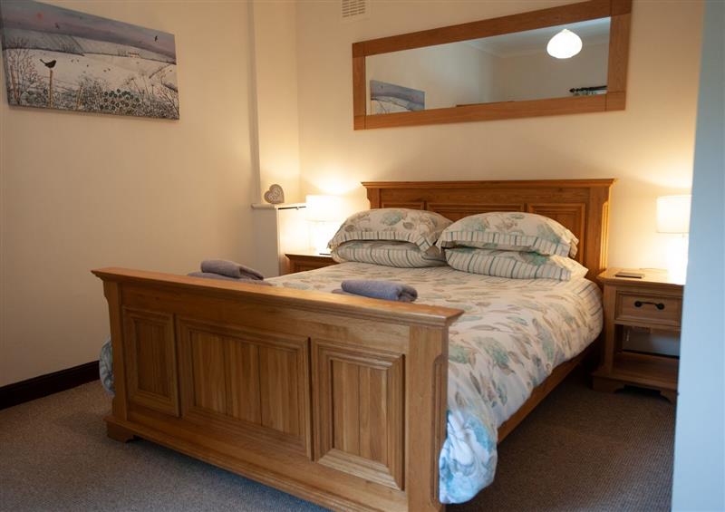 A bedroom in Glasinfryn Cottage at Glasinfryn Cottage, Llanbedrgoch near Benllech