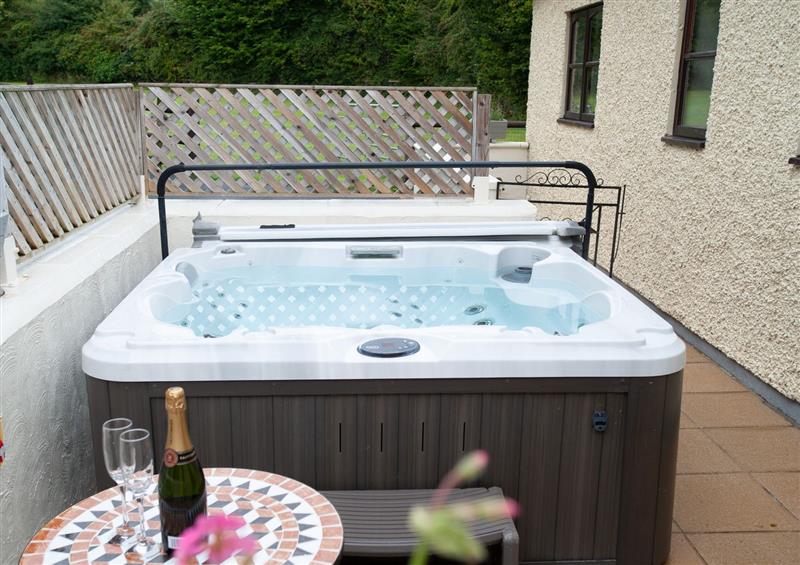 There is a hot tub at Glasinfryn Cottage, Llanbedrgoch near Benllech