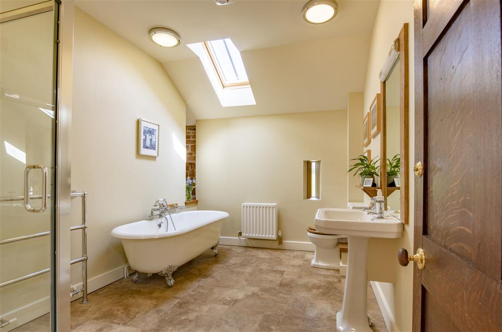 Bedroom one’s en-suite bathroom with traditional cast iron roll top bath at Glassonby Old Hall and Jennys Croft, Glassonby