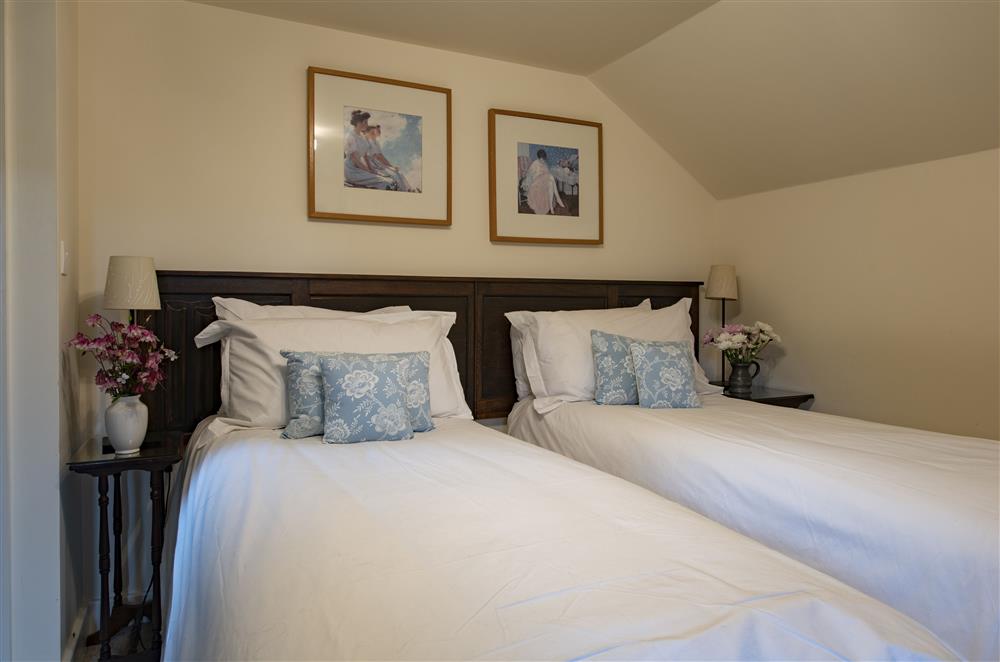 Bedroom two with twin 2’6 zip and link beds and en-suite shower room at Glassonby Old Hall and Jennys Croft, Glassonby