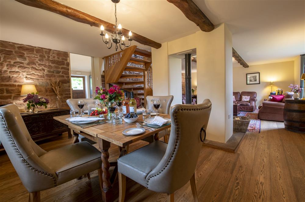 Dining room with exposed beams and stonework at Glassonby Old Hall and Jennys Croft, Glassonby