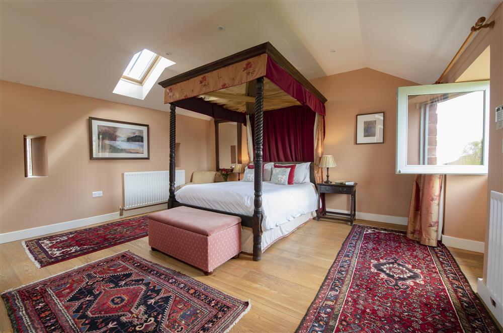 Exquisite bedroom one with a 5’ king-size four poster bed and en-suite bathroom at Glassonby Old Hall and Jennys Croft, Glassonby