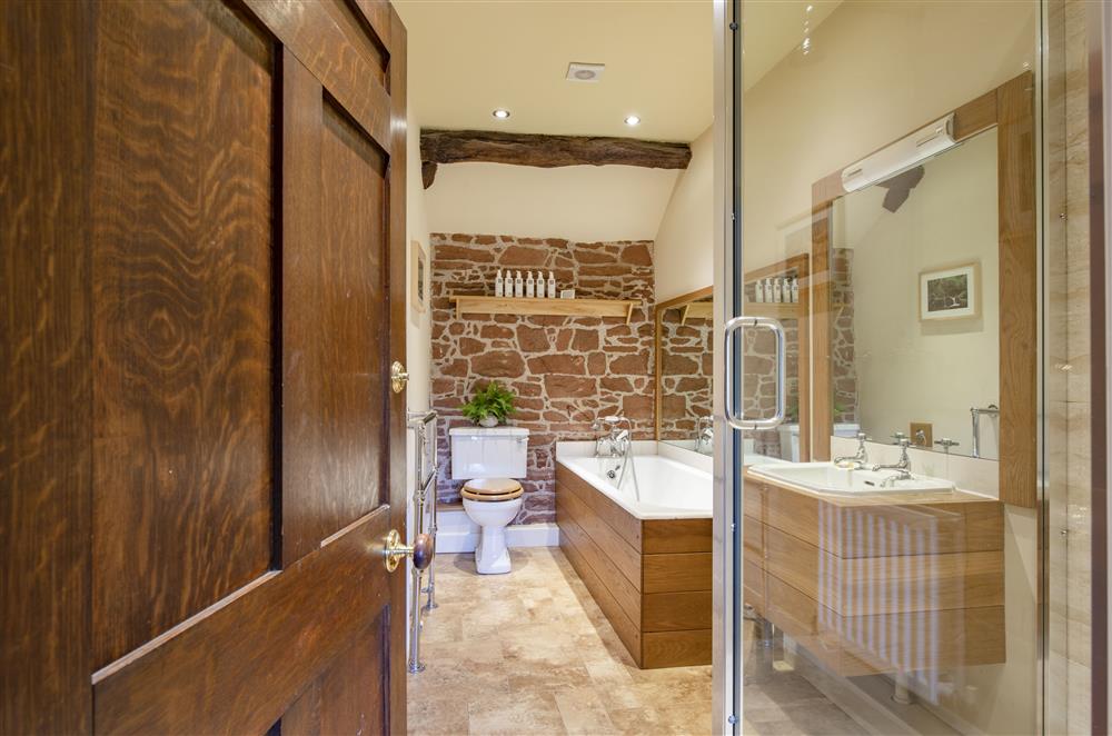 Family bathroom with rainfall shower and cast iron bath at Glassonby Old Hall and Jennys Croft, Glassonby