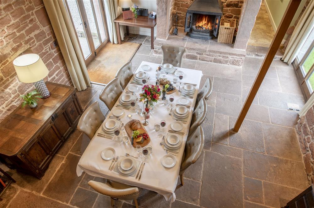 Gallery view of the dining room with double doors leading to the sandstone terrace  at Glassonby Old Hall and Jennys Croft, Glassonby