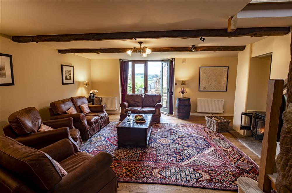 Relax by the double sided cast iron wood burner in the spacious sitting room at Glassonby Old Hall and Jennys Croft, Glassonby