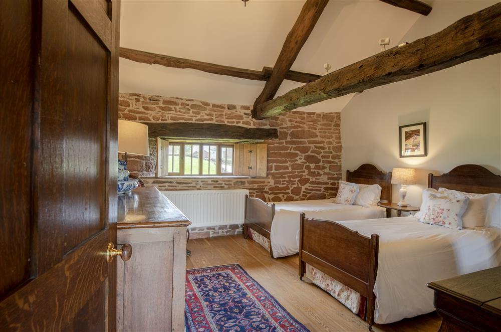 Salkeld bedroom four with twin 3’ single beds and exposed beams at Glassonby Old Hall and Jennys Croft, Glassonby