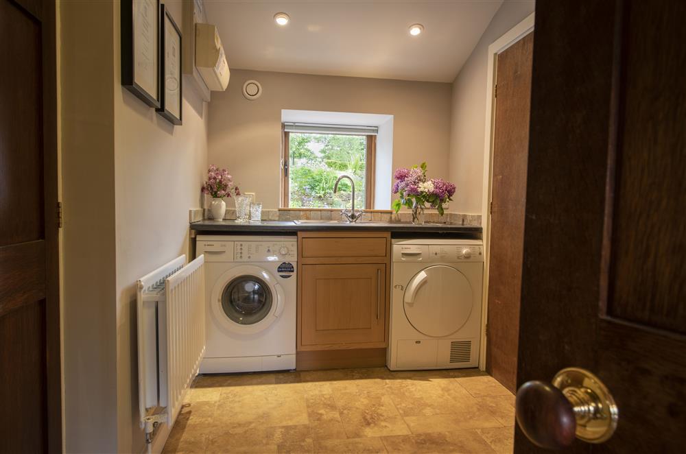 Utility room with washing machine and tumble dryer (photo 2) at Glassonby Old Hall and Jennys Croft, Glassonby