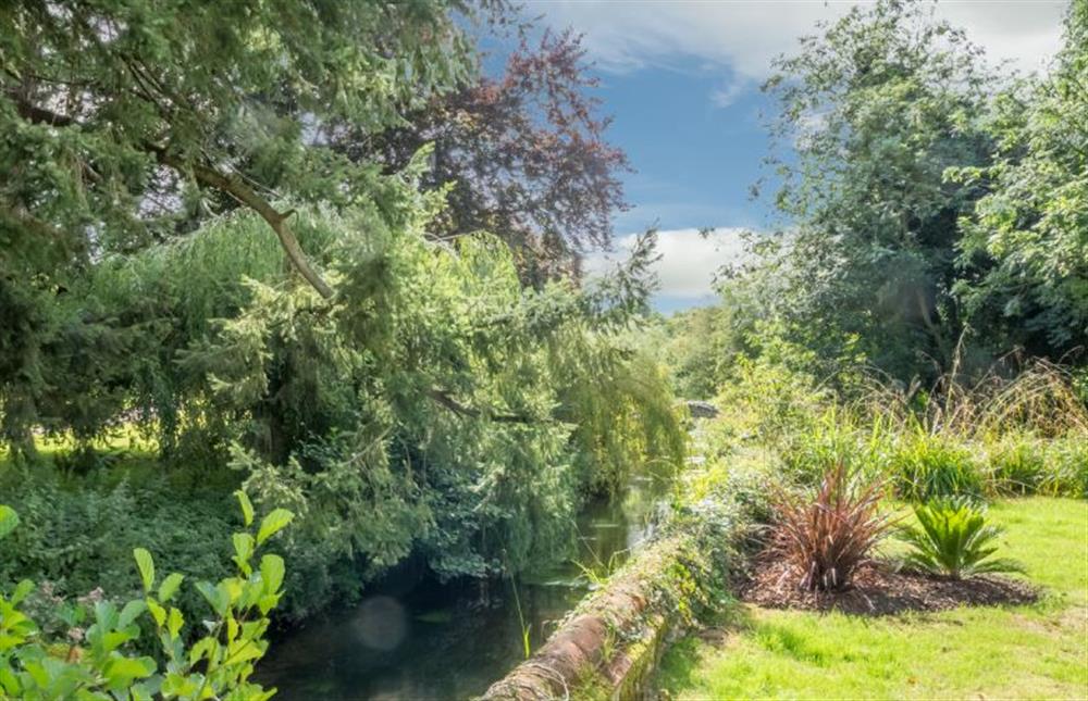 Delightful garden with river at Glaven Cottage, Letheringsett near Holt