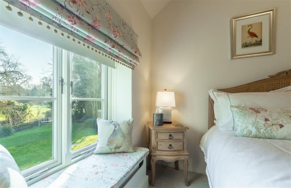 First floor: Bedroom two has double bed and garden views (photo 2) at Glaven Cottage, Letheringsett near Holt