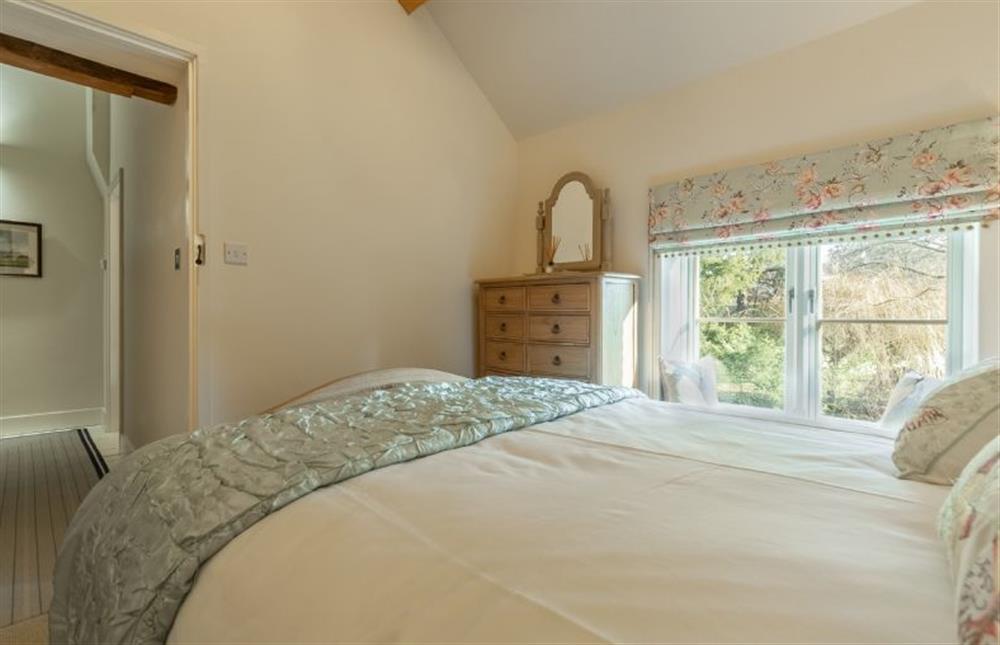 First floor: Bedroom two has en-suite shower room at Glaven Cottage, Letheringsett near Holt
