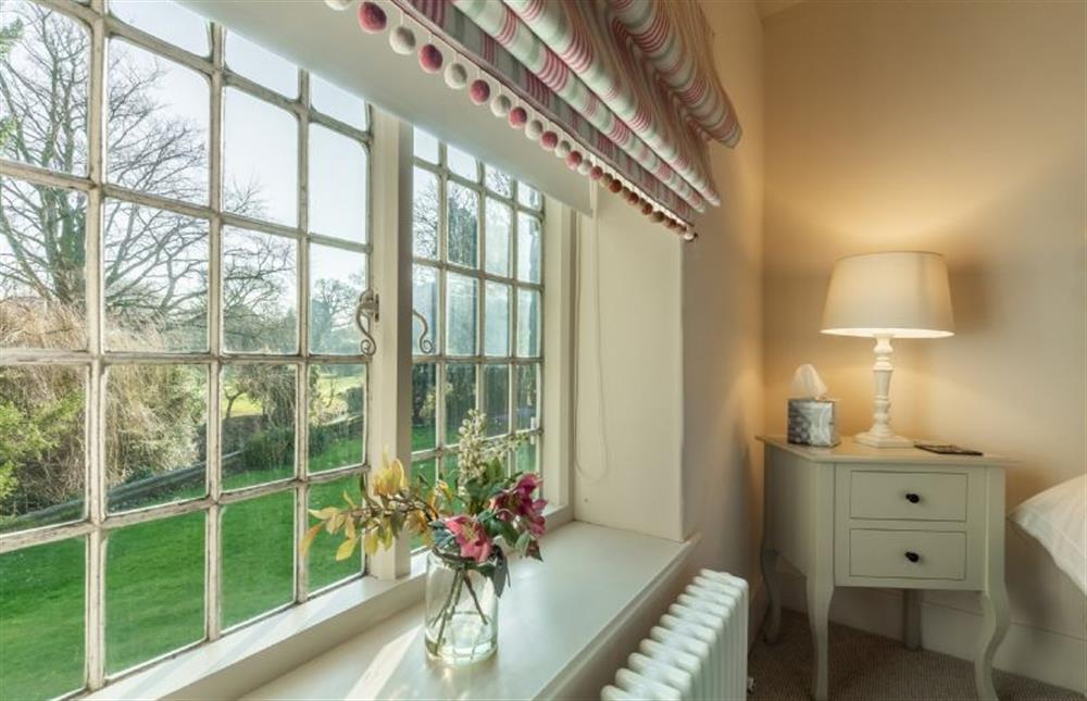 First floor: Garden views from bedroom three at Glaven Cottage, Letheringsett near Holt