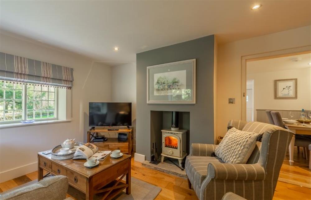 Ground floor: The sitting room has a wood burning stove at Glaven Cottage, Letheringsett near Holt