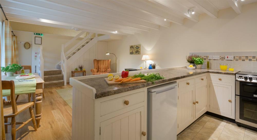 The open plan kitchen, sitting and dining room at Glebe Cottage in Falmouth, Cornwall