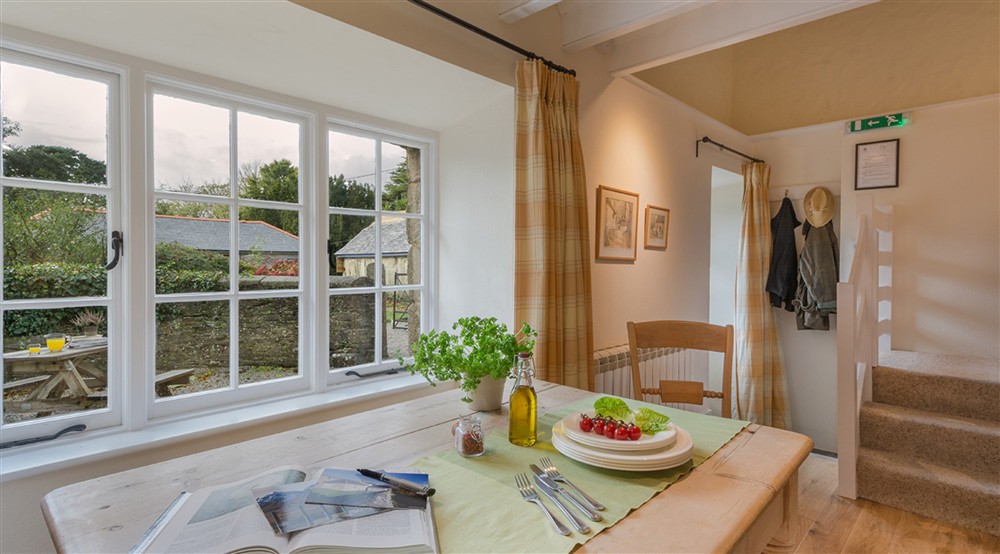 The sitting _ dining room at Glebe Cottage in Falmouth, Cornwall