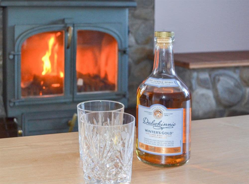 Relax in front of the cosy wood burner at Glebe Cottage in Urray, near Dingwall, Highlands, Ross-Shire