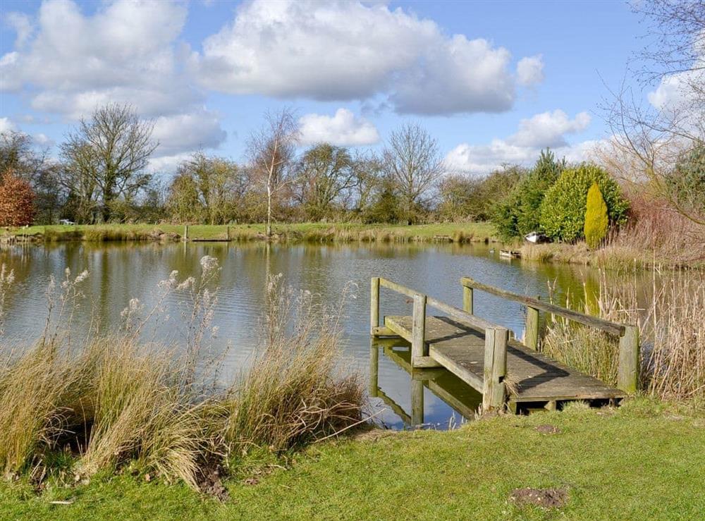 Well-stocked fishing lake within grounds at Glebe Pine Lodge, 