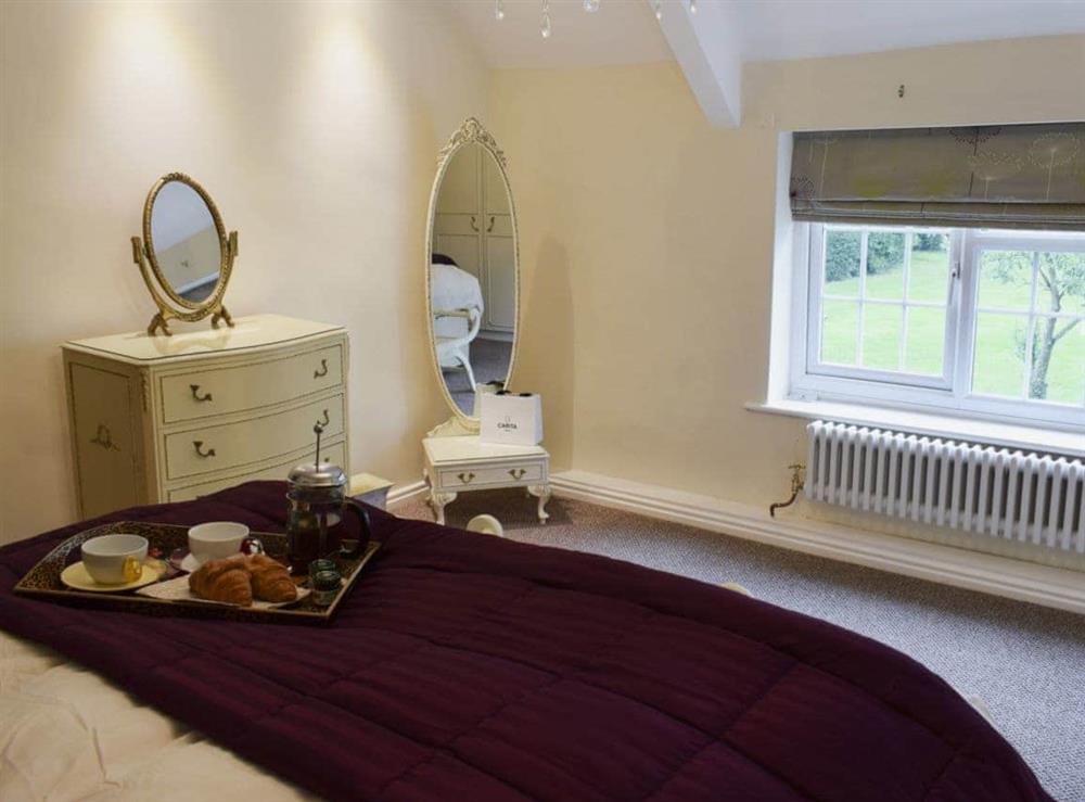 Bedroom with zip and link super kingsize bed (photo 2) at Glebe Farm Cottage in Hornby, North Yorkshire