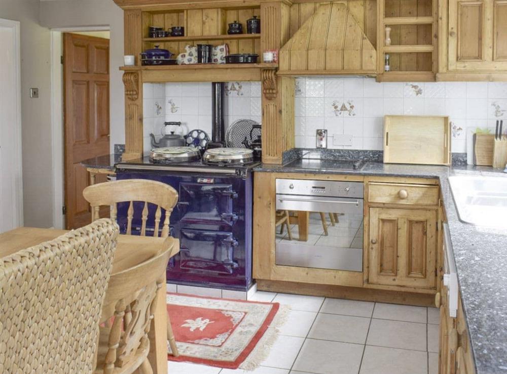 Well-equipped kitchen with dining area at Glebe Farm Cottage in Hornby, North Yorkshire
