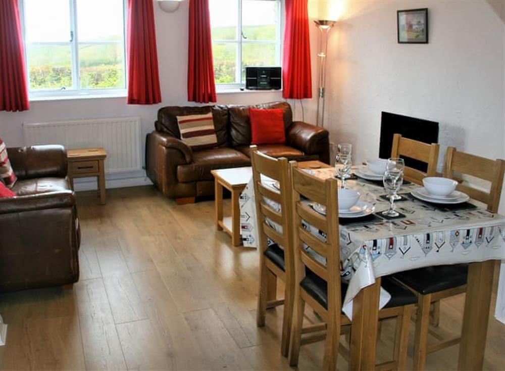 Comfortable living/dining room at Gamekeepers Cottage, 