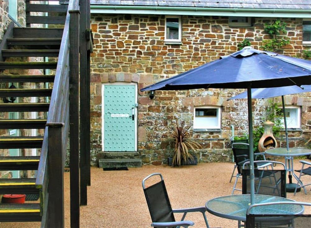 Courtyard with garden furniture at Gamekeepers Cottage, 