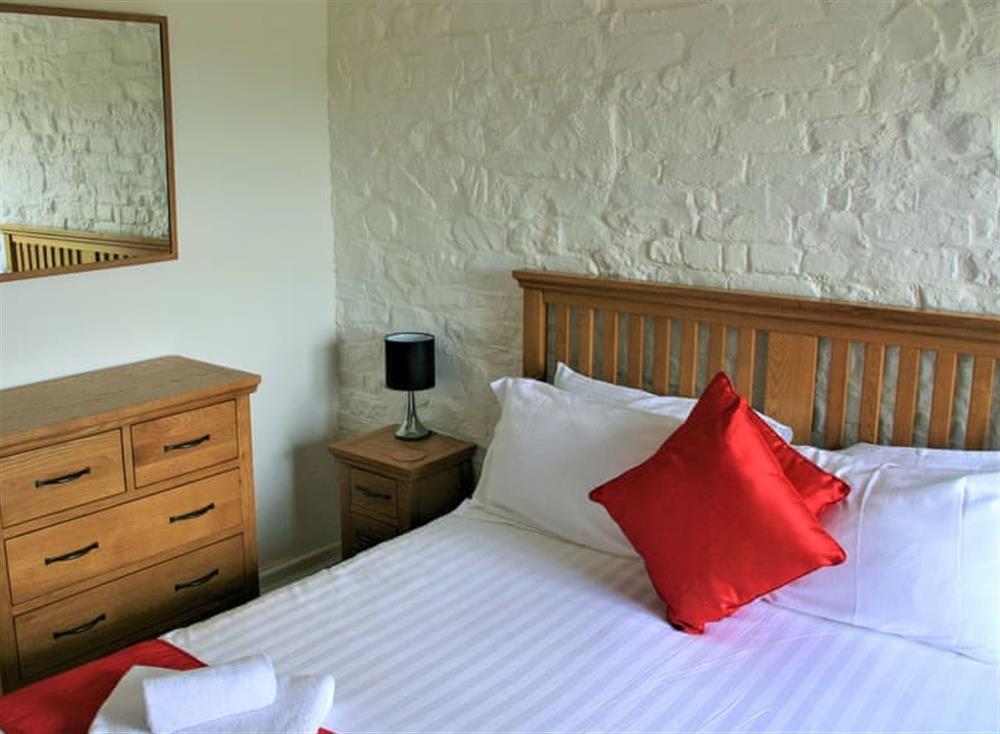 Relaxing bedroom with kingsize bed at Old Stables, 