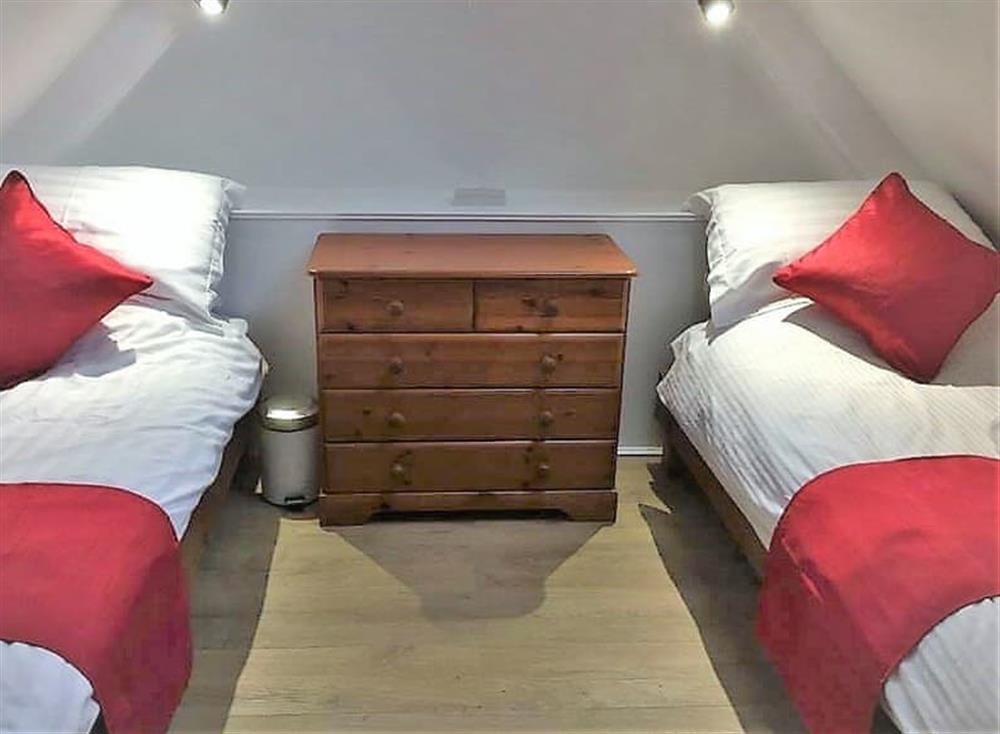 Galleried bedroom with twin beds at The Granary, 