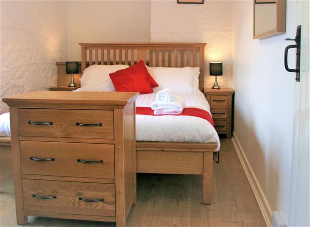 Tranquil bedroom with kingsize bed at The Mews, 