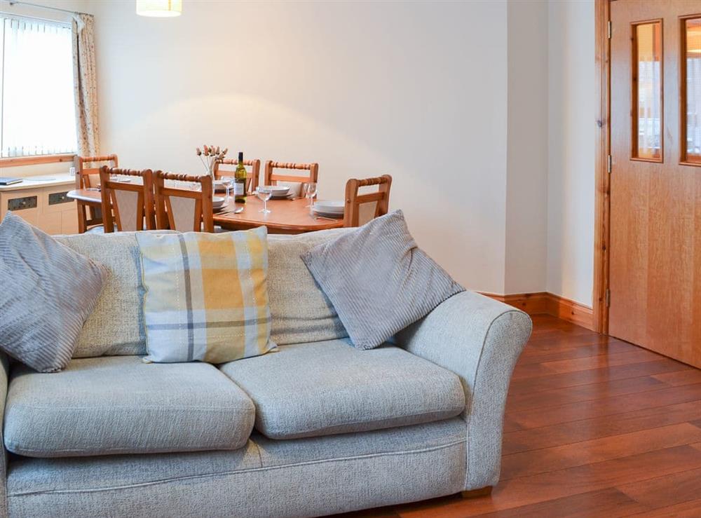 Comfortable living/dining room at Glen Apartment in Aviemore, Inverness-Shire